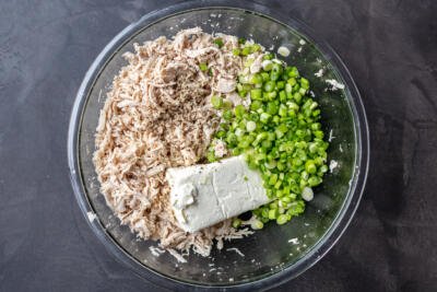 chicken, green onions and cream cheese in a bowl