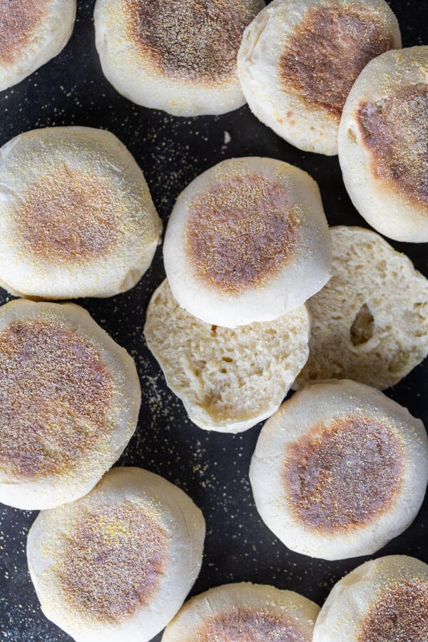 Sliced open English Muffin and others around.
